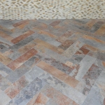 Photo of the tile work done in a dental office waiting room.
