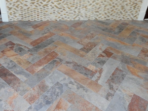 Photo of the tile work done in a dental office waiting room.